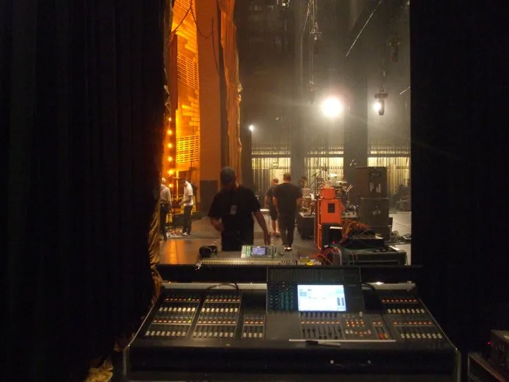 Monitor console in the wings with the crew setting the stage